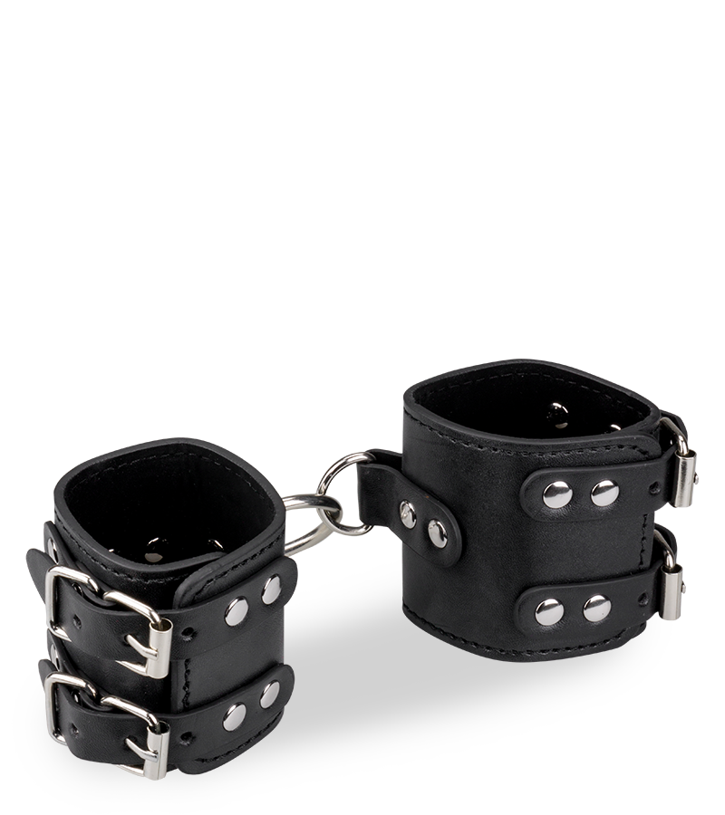 Black leather BDSM handcuffs with straps