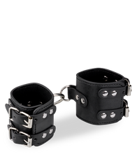 Load image into Gallery viewer, Black leather BDSM handcuffs with straps