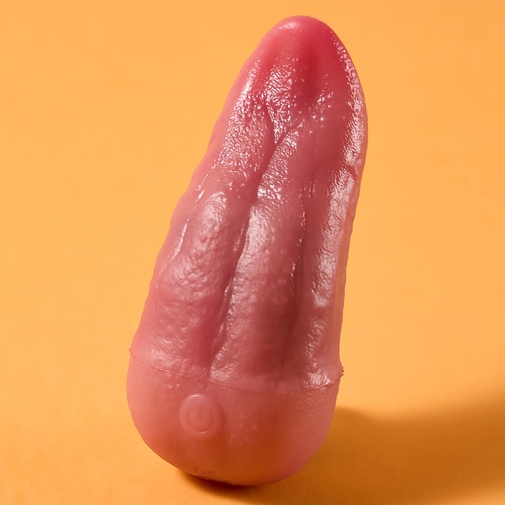 Joylume Velvet Flick handheld tongue style vibrator shown in lifestyle setting